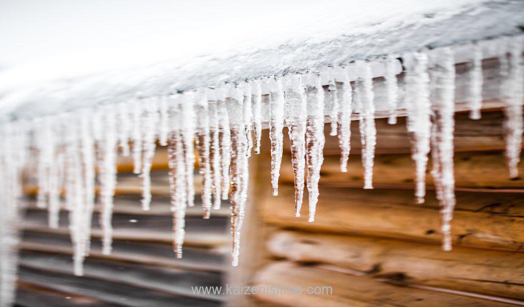 Long Icicles Melting of a roof top